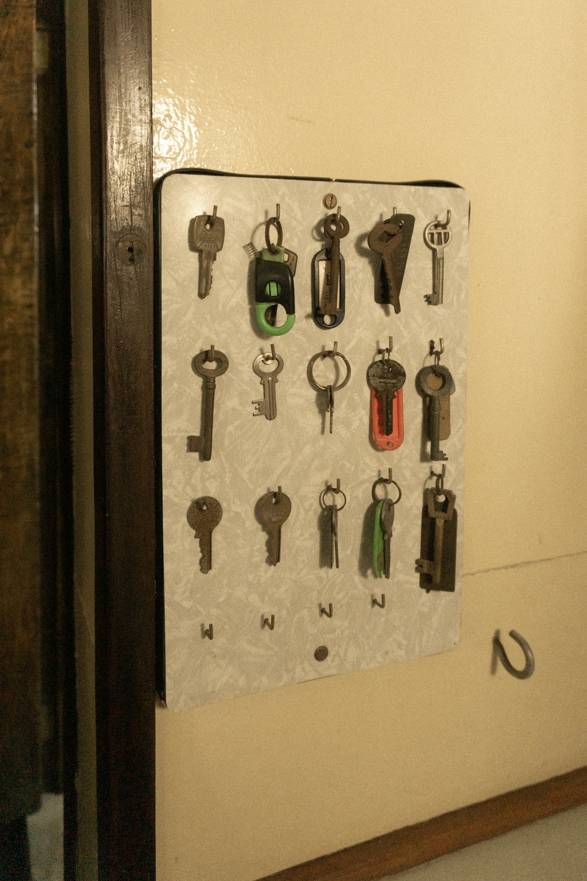 A bunch of keys hanging on a wall